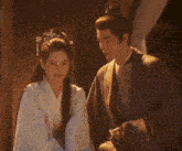 a man and a woman are posing for a picture