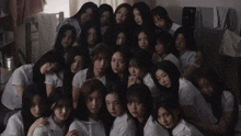 a group of young women are posing for a photo