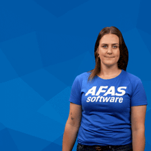 a woman in a blue shirt holds a sign that says nee joh