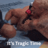 two men wrestling with the words it 's tragic time written below them