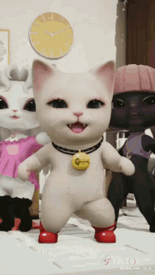 three cartoon cats are dancing in front of a clock that says tik tok lite