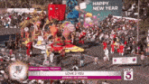 a parade with a float that says love 2 yeu