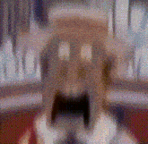 a close up of a person 's face with a surprised look on it .