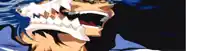 a close up of a person 's face with sharp teeth and blue hair