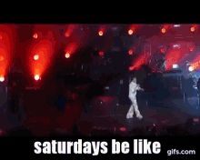 a man dancing on a stage with the words saturdays be like