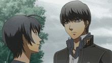 two anime characters looking at each other with one wearing a jacket with the letter i on the collar