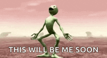 a green alien is dancing in a desert with the words `` this will be me soon '' .