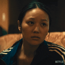a close up of a woman 's face with a netflix logo visible