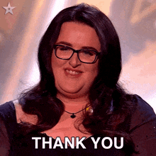 a woman wearing glasses and a necklace says " thank you "