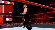 Roman Reigns Superman Punch GIF - Roman Reigns Superman Punch Kevin Owens GIFs