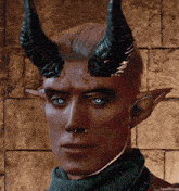 a man with horns on his head is wearing a scarf and a nose ring .
