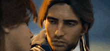 a man and a woman are looking at each other with their eyes closed .