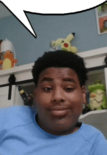 a man in a blue shirt with a speech bubble in the background