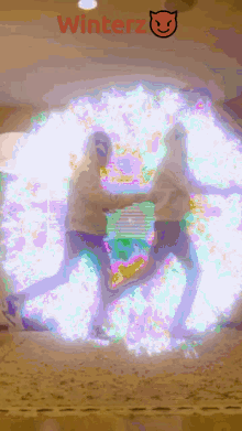 two people are standing in front of a glowing circle that says winterz on it