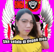 a woman wearing glasses and a yellow shirt with singa on the background