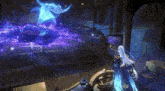 a person is standing in a dark room with a blue light coming out of the ceiling