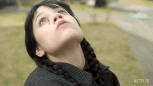 a girl with a tear coming out of her nose and a netflix logo in the corner