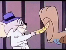 a cartoon mouse is holding a feather in front of a squirrel 's foot in a jail cell .