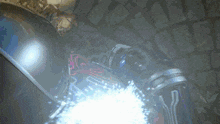 a person is standing in a dark room with a light coming out of their mouth