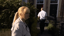 a man carrying a briefcase with the letter l on it