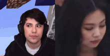 a man wearing headphones looks at a woman with her eyes closed