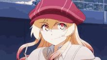 a girl wearing a red hat and glasses is looking at the camera .