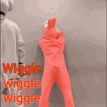 a man is taking a picture of a person in a pink bunny costume