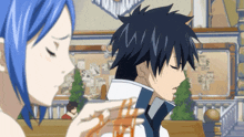 a girl with blue hair is looking at a boy with black hair