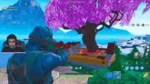 a man is playing a video game with a tree in the background
