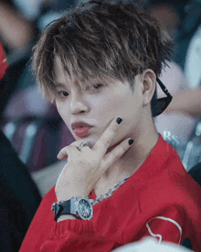 a close up of a person 's face with rs written on the bottom right