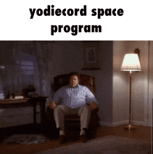 a man is sitting in a chair in a living room with the words yodiecord space program above him