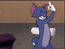 tom from the cartoon tom and jerry is giving the middle finger while holding a cup .