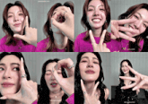 a woman in a purple shirt is making a hand gesture