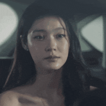 a woman with a watch on her wrist has a tear running down her cheek
