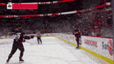 a hockey player with the number 10 on his jersey is skating on the ice