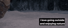 a person laying in the snow with the words " i love going outside and enjoying nature " below them