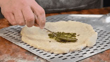 Spreading Pesto Sauce The Hungry Hussey GIF - Spreading Pesto Sauce The Hungry Hussey Making A Pizza GIFs