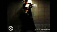 a video of a person in a bathroom with the words " 2 opium / interscope " at the top