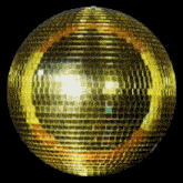 a gold disco ball with a yellow circle around it