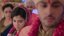 a bride and groom standing next to each other