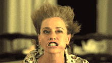 a close up of a woman making a face with her mouth open