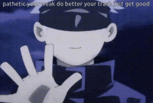 a man is making a peace sign with his hands in front of his face .