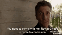 a man is standing in front of a concrete wall and saying you need to come with me ray you need to come to confession .