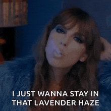 a woman blowing a purple bubble with the words " i just wanna stay in that lavender haze " below her