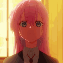 a close up of a pink haired anime girl with blue eyes