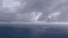 a cloudy sky with a few white clouds and a few gray clouds