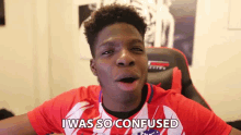 a young man in a red and white shirt is making a funny face and saying i was so confused