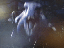 a close up of a monster 's face with its mouth open .