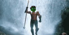 a man in a superhero costume is standing in front of a waterfall holding a spear .