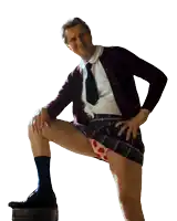 a man in a plaid skirt and polka dot underwear holds his leg up